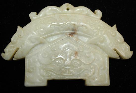 A Chinese jadeite archaistic double dragon plaque, 9.5cm